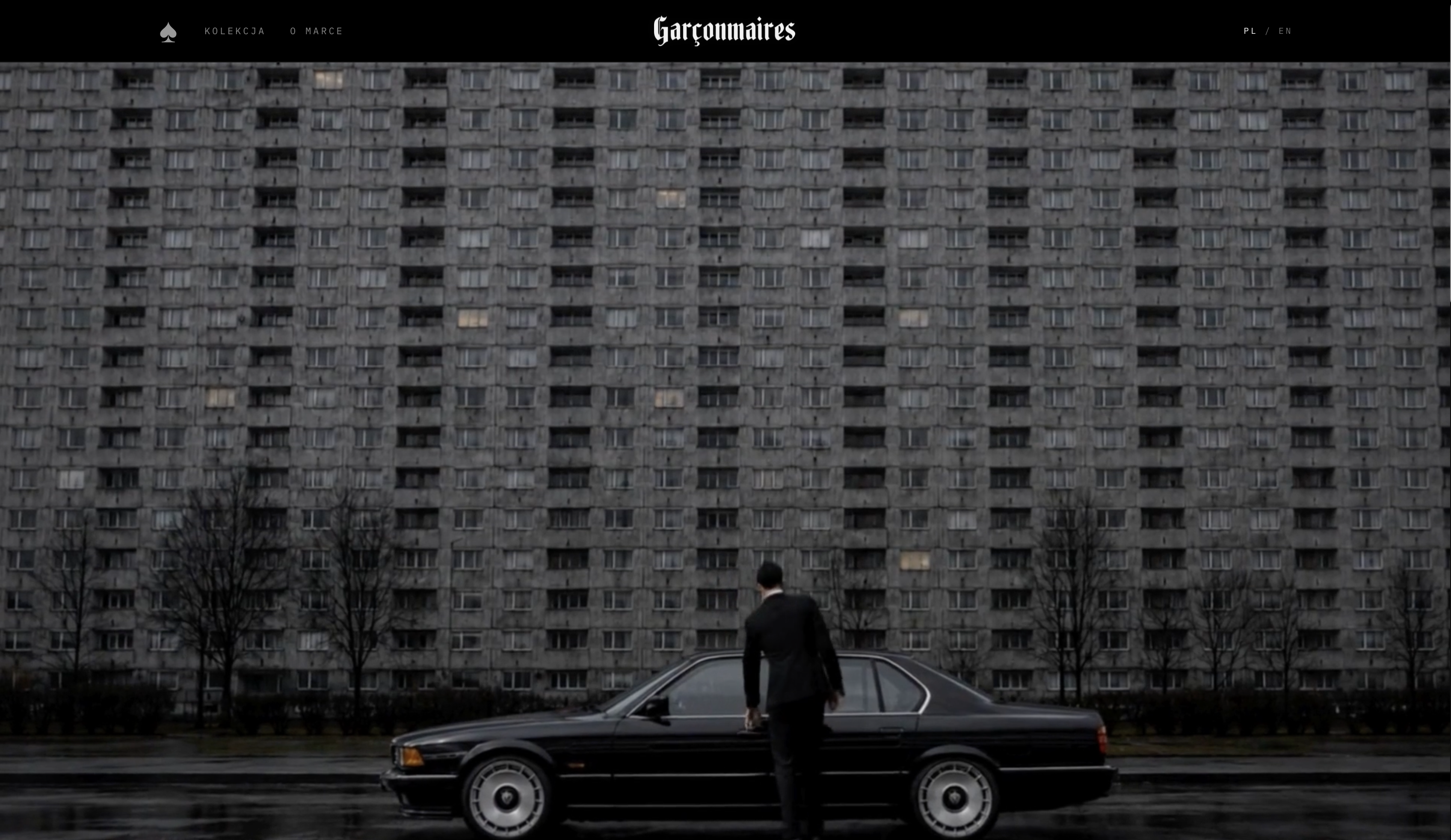 Garçonmaires website hero with black BMW, fashion model and brutalist housing block